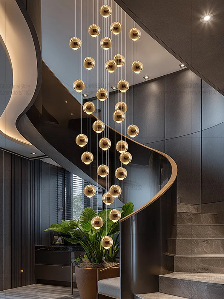 Modern MC THE BLACK DIAMOND LED staircase pendant light hanging in a living room, showcasing sleek design and warm illumination.