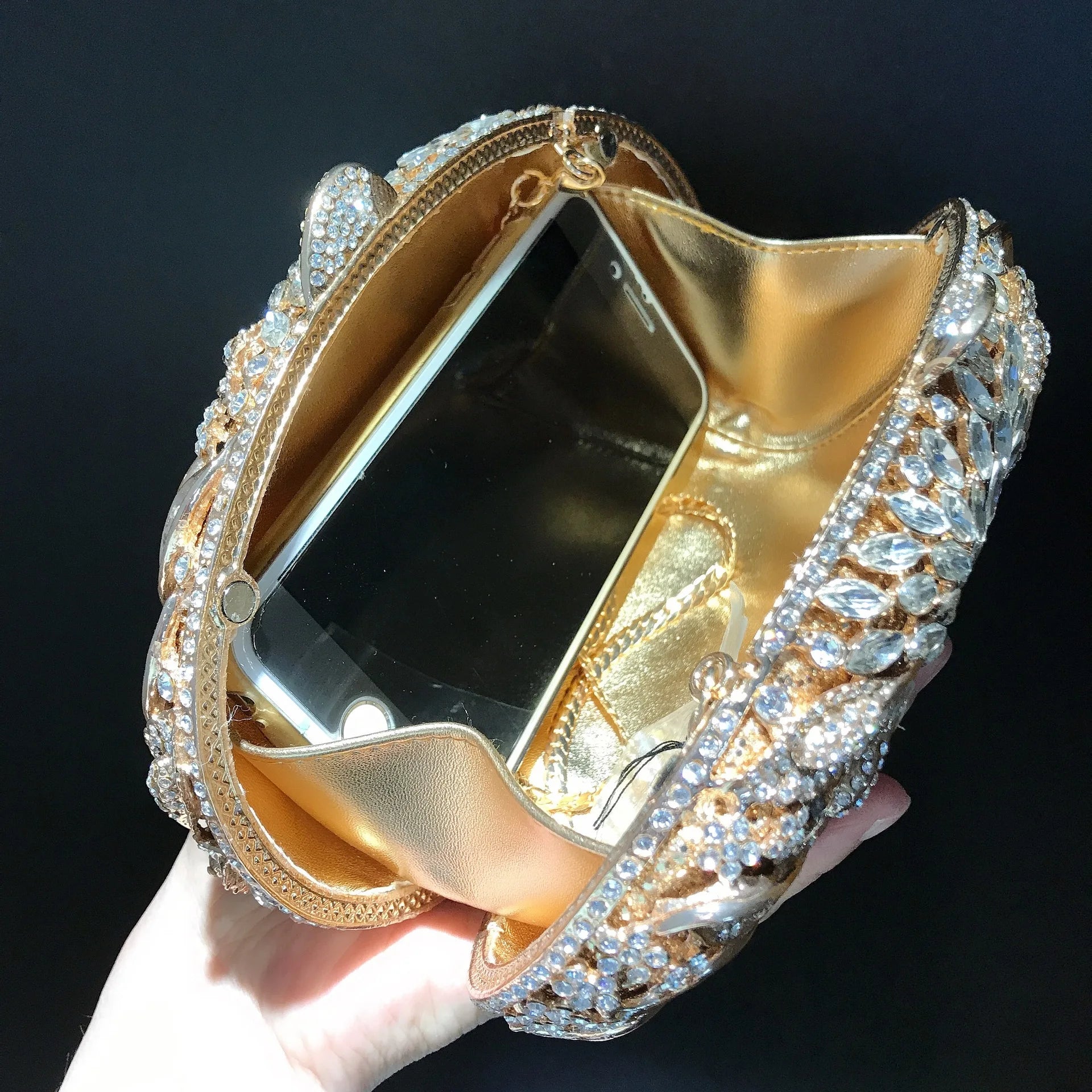 Gold metal leaf evening clutch bag with white crystals, luxury women’s ball handbag for wedding and party occasions.