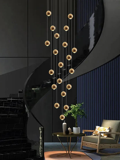 Modern MC THE BLACK DIAMOND LED staircase pendant light hanging in a living room, showcasing sleek design and contemporary style.