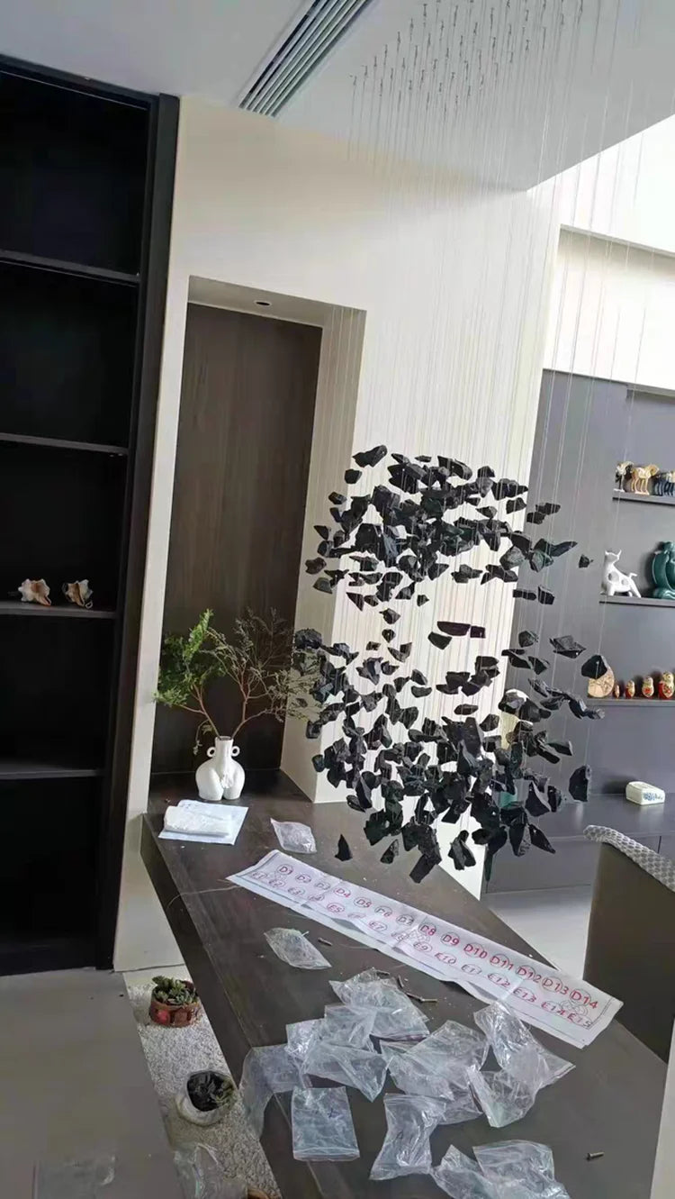 Black Art Luxury Stone Crystal Chandelier by MC THE BLACK DIAMOND hanging in a modern staircase hallway with LED lighting.