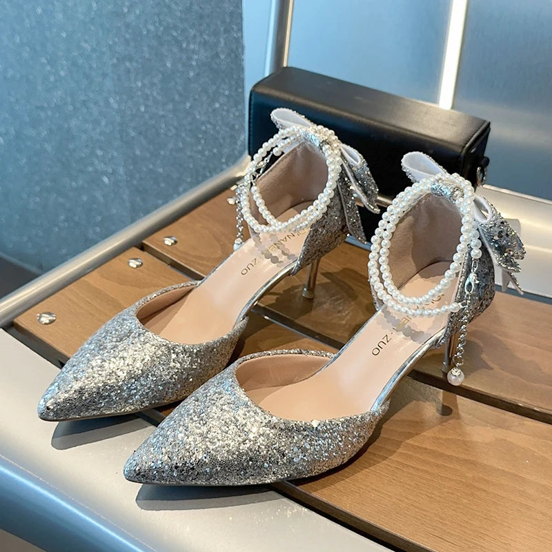 Elegant Mohamad Collection French pointy high heels with sequin bow, pearl line, and shallow mouth design for women.