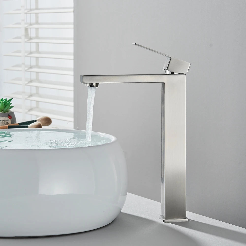 Matte black stainless steel bathroom sink faucet with hot and cold water mixer, waterfall spout, deck-mounted design.
