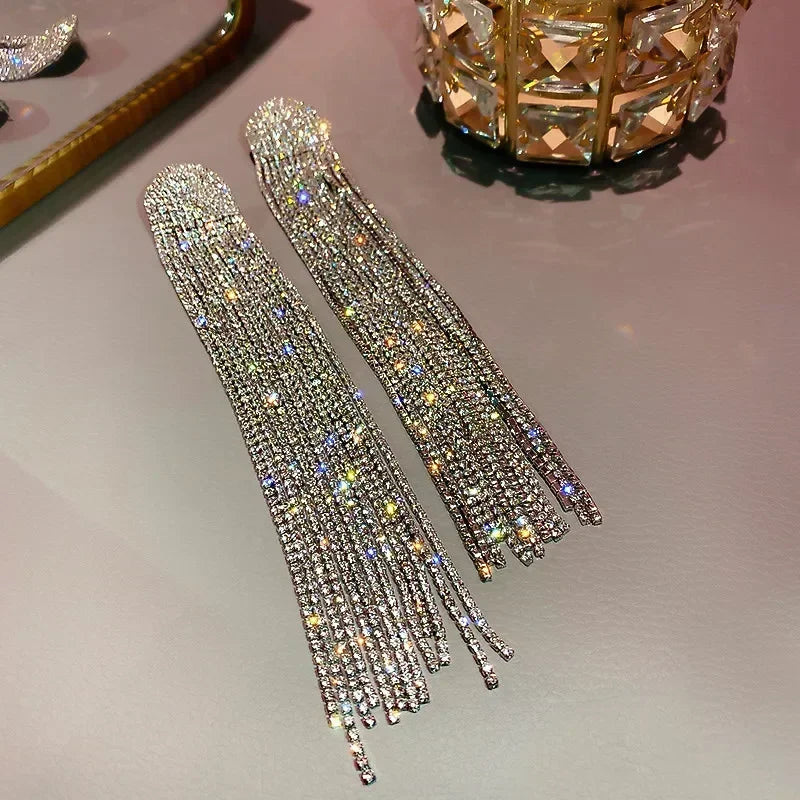 MC THE BLACK DIAMOND long tassel rhinestone earrings with crystal dangles, stylish jewelry accessory for women.