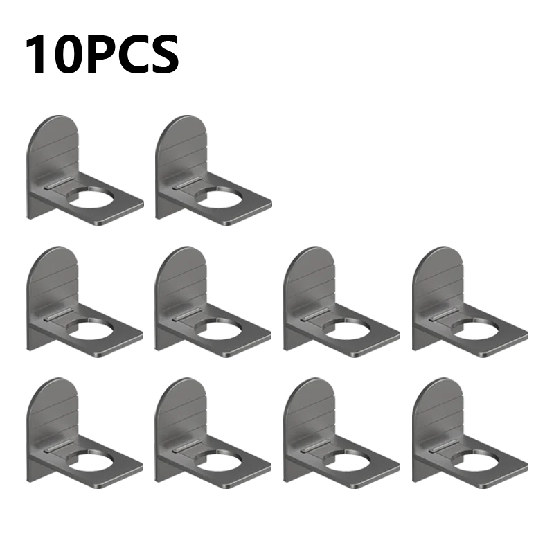 Metal self-adhesive shampoo bottle holder from MC The Black Diamonds, mounted on a bathroom wall for shower gel and liquid bottles.