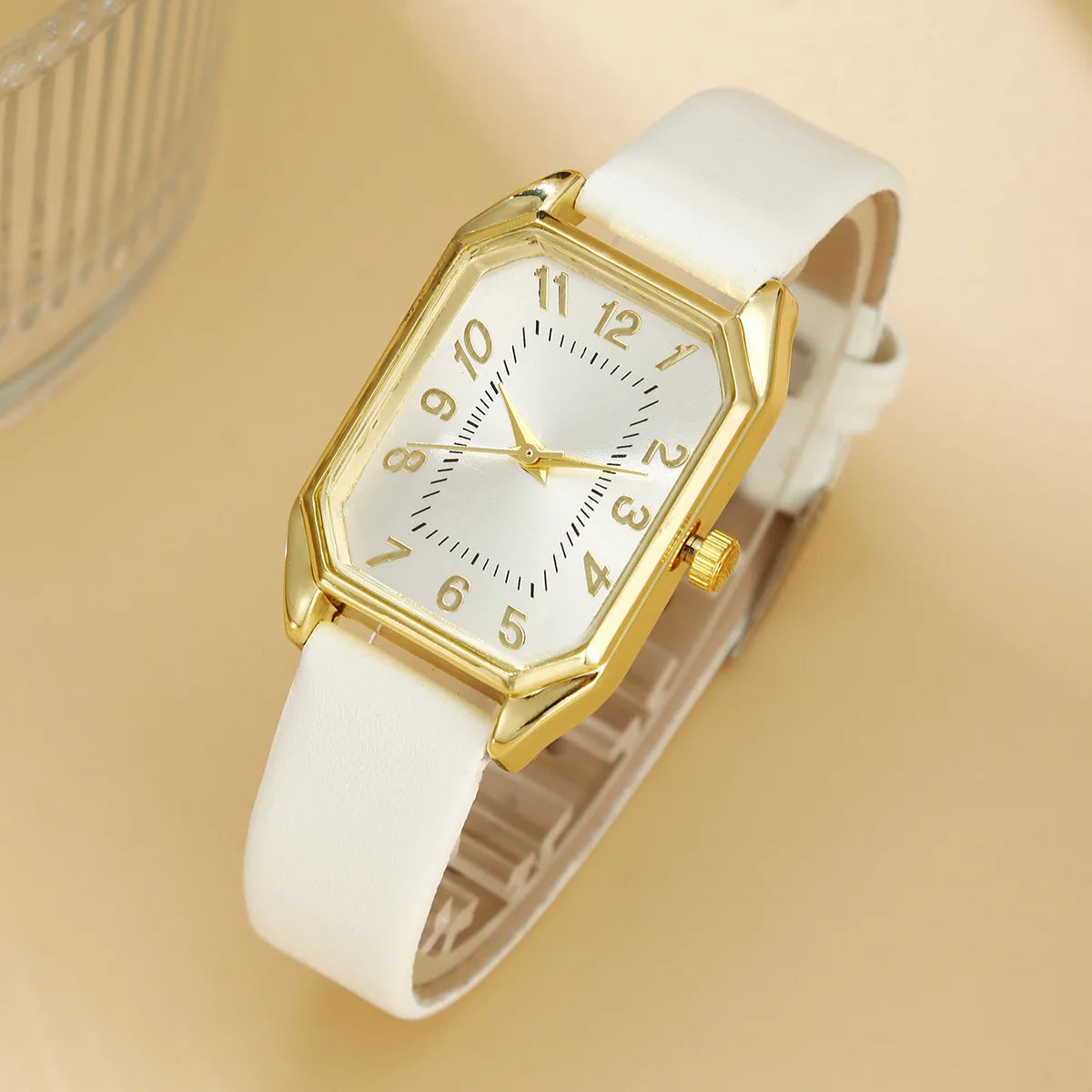 Luxury women's square jewelry watch from Mohammad Collection, featuring a sleek design and elegant gold-tone band.
