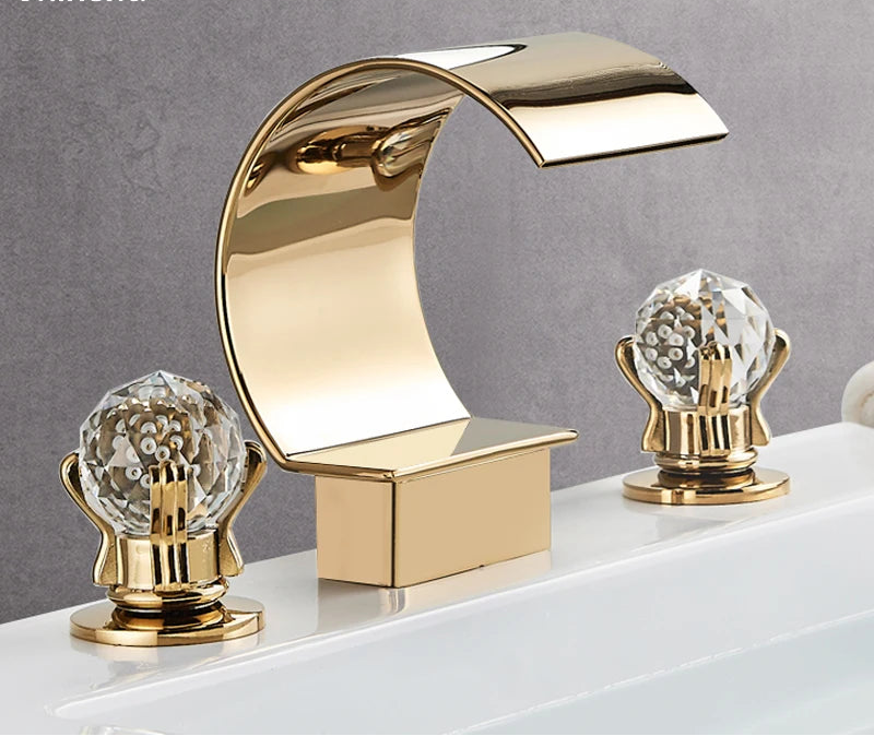 MC THE BLACK DIAMOND Shinesia luxury golden bathroom basin faucet with dual handles and waterfall spout for vessel sinks.