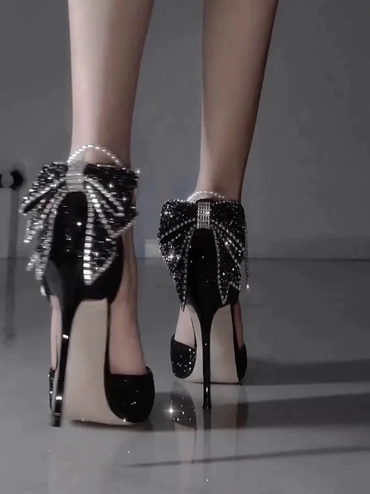 Elegant French pointy high heels by Mohammad Collection featuring sequins, a bow, pearl lining, and a shallow mouth design.