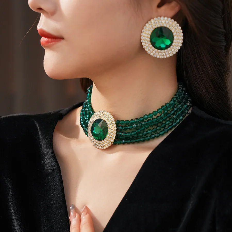 Green glass and rhinestone jewelry set with necklace and earrings, featuring inlaid rhinestones and a luxurious, elegant design for women.