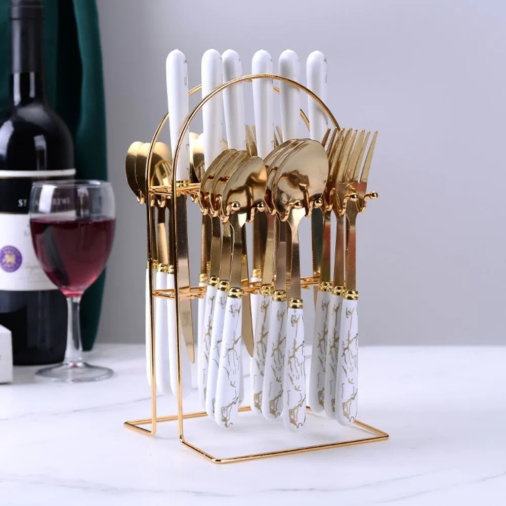 24-piece stainless steel marbled tableware set by Mc The Black Diamonds, includes knives, forks, spoons with reflective mirror finish.