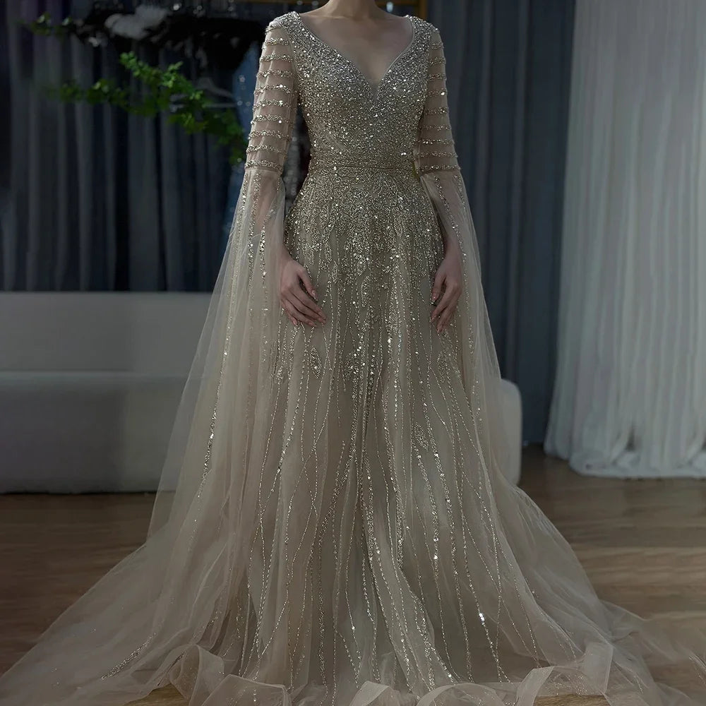 Elegant Arabic caramel-colored dress by MC THE BLACK DIAMOND, featuring intricate details and a flowing silhouette.