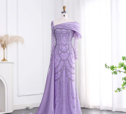 Elegant one-shoulder evening dress in luxurious tulle by MC THE BLACK DIAMOND featuring a flowing silhouette and sophisticated design.