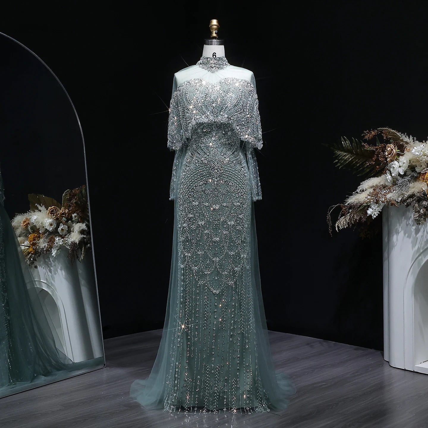 Beaded grey Arabic evening dress by MC THE BLACK DIAMOND featuring intricate beading and elegant design.