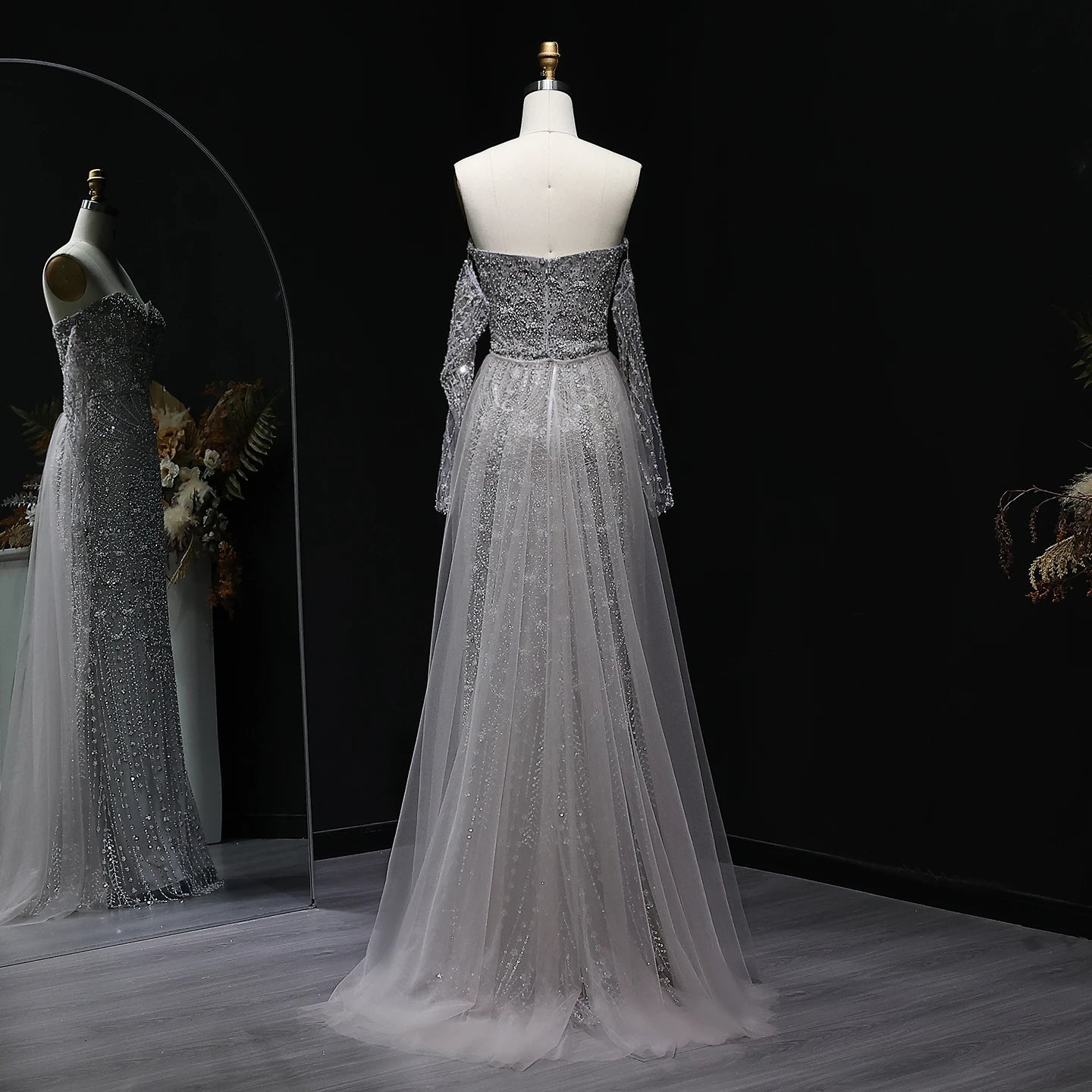 Beaded grey Arabic evening dress by MC THE BLACK DIAMOND featuring intricate embroidery and elegant design.