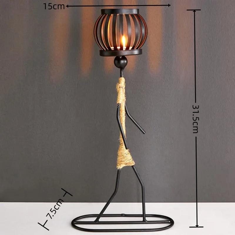 Nordic metal candle holder with abstract character sculpture by 𝕄𝕎𝕍𝕙𝕠𝕝𝕚𝕤𝕥𝕚𝕔, featuring handcrafted figurines for home decor and art gifts.