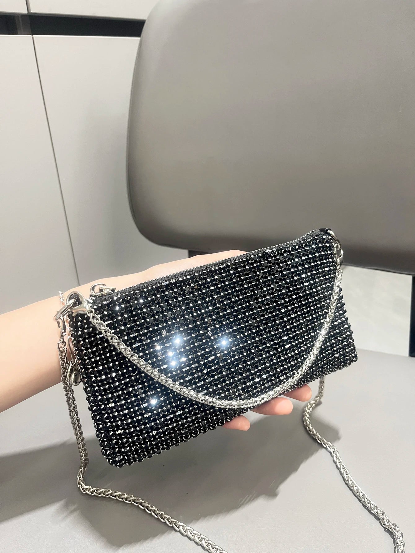 Luxury MC THE BLACK DIAMOND rhinestone clutch purse with a handle, stylish women's shoulder hand bag featuring sparkling embellishments.