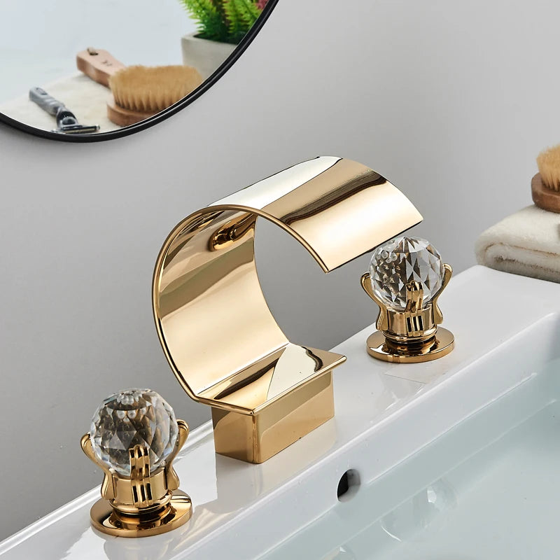 MC THE BLACK DIAMOND Shinesia luxury golden bathroom basin faucet with dual crystal handles and waterfall spout for vessel sinks.