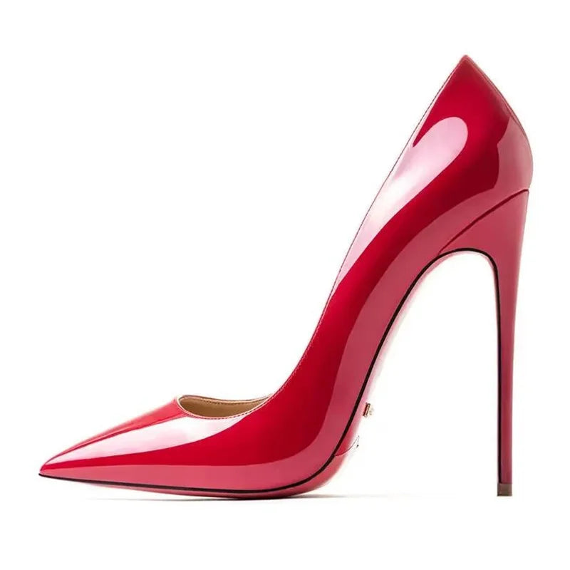 Plus size red women’s pumps with pointed toes and rubber soles, ideal for dressy events and parties.