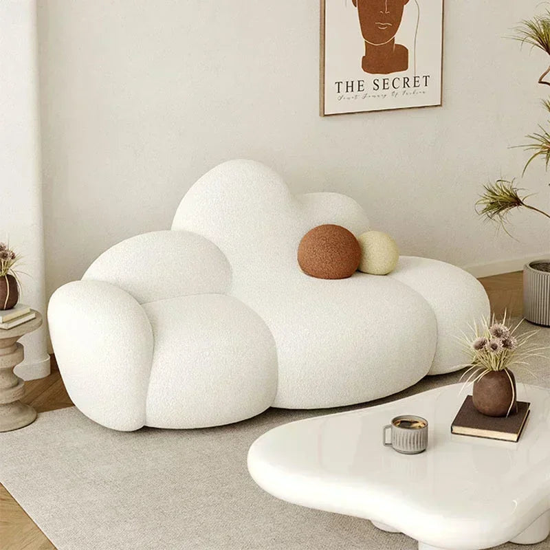 White MC THE BLACK DIAMOND sofa in a living room, showcasing a comfortable, relaxing lounge sofa with soft cushions and stylish design.