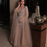 Elegant MC THE BLACK DIAMOND evening gown with batwing sleeves, shiny tulle, sequins, and intricate applique for a glamorous party look.