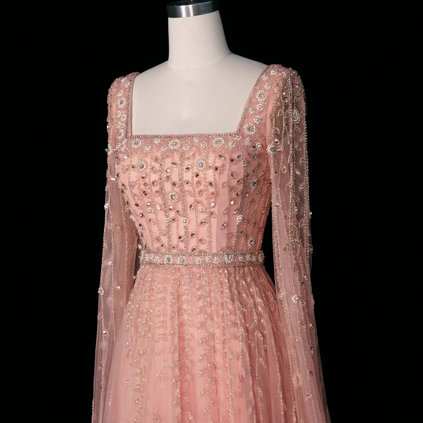 Elegant pink Dubai evening dress by MC THE BLACK DIAMOND featuring a flowing fabric and intricate design, perfect for formal occasions.