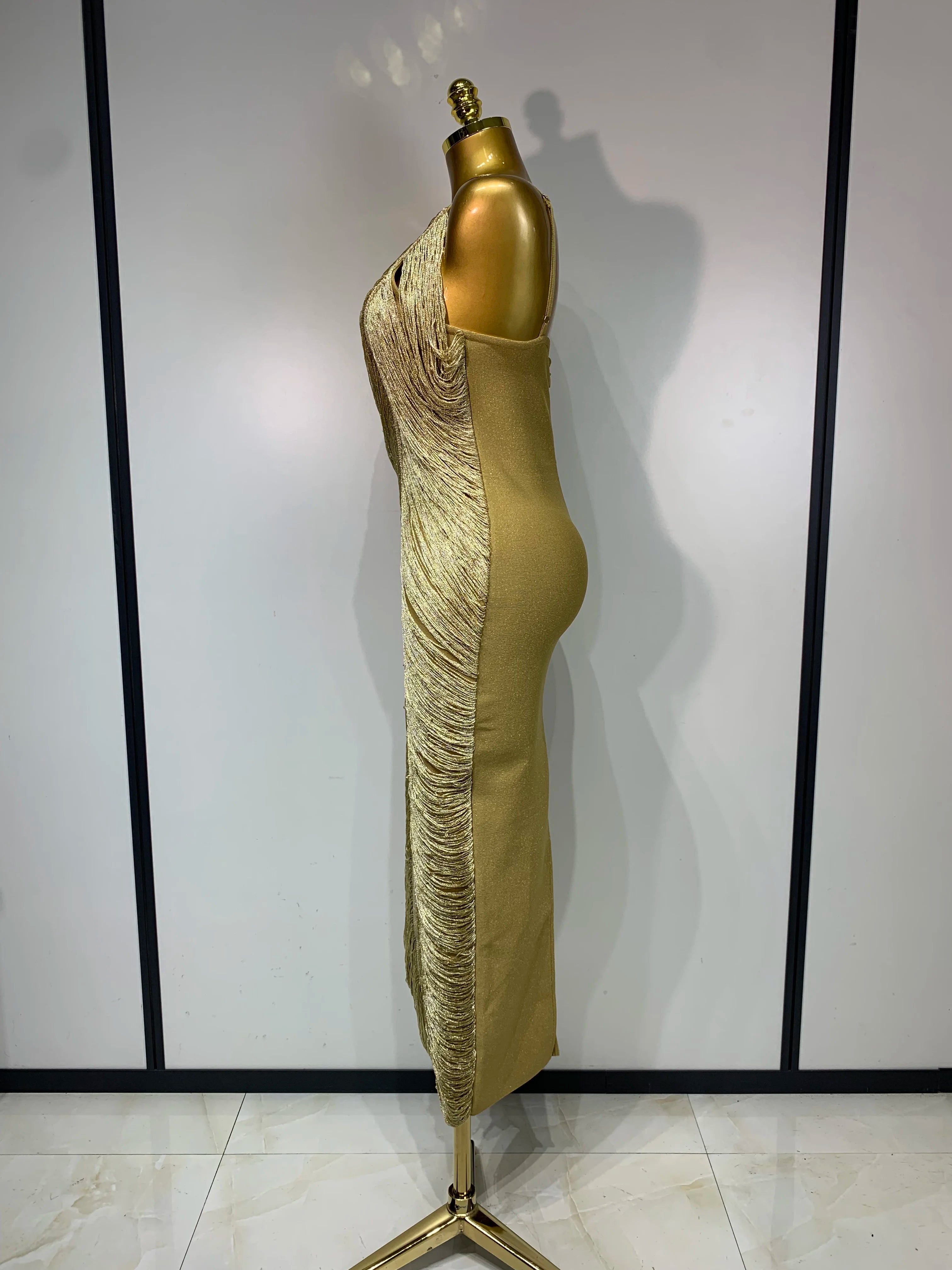 MC Women backless gold bodycon bandage dress with tassel details, designed by MC THE BLACK DIAMOND for a sleek, stylish look.