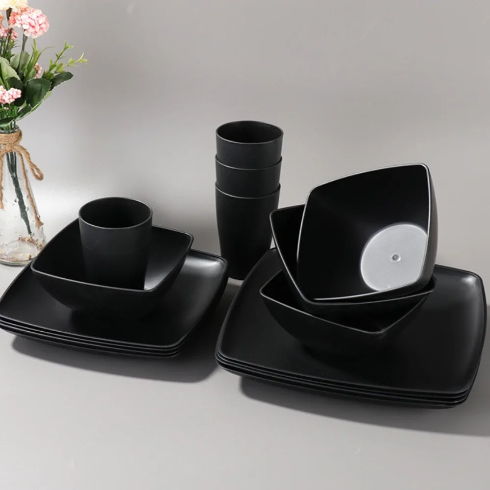 16-piece square plastic dinnerware set from MC The Black Diamonds, including plates and bowls for kitchen use.