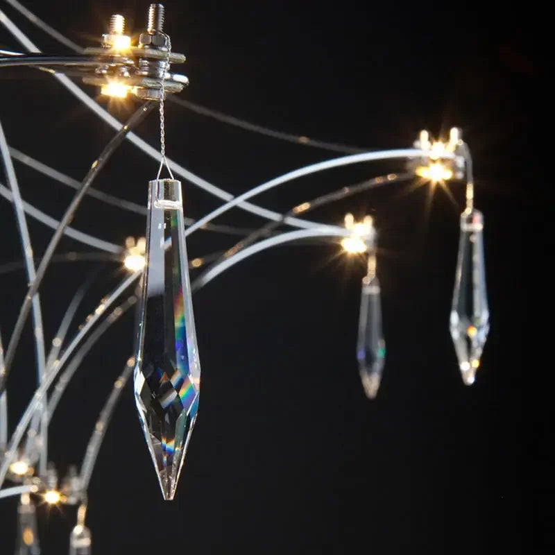 Modern chrome-plated luxury crystal chandelier with multiple hanging crystals, ideal for living room, bedroom, or dining area lighting.