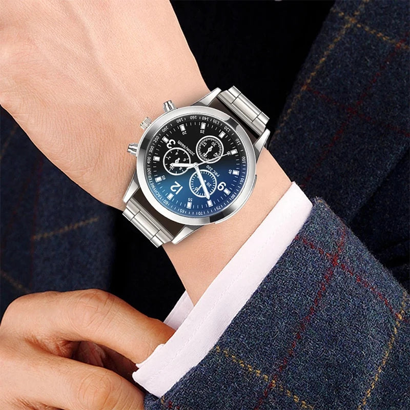 Matching couple's watches by MC The Black Diamonds, featuring sleek black watch faces and silver bands for him and her.