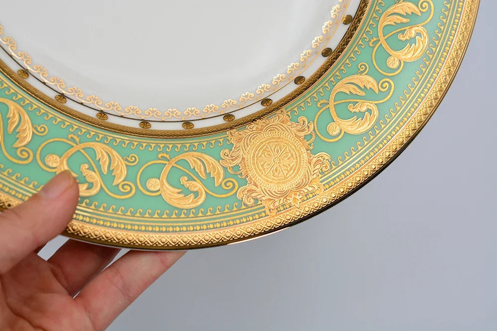 Embossed gold porcelain dinnerware set by MC THE BLACK DIAMOND featuring luxury bone china with intricate gold detailing.