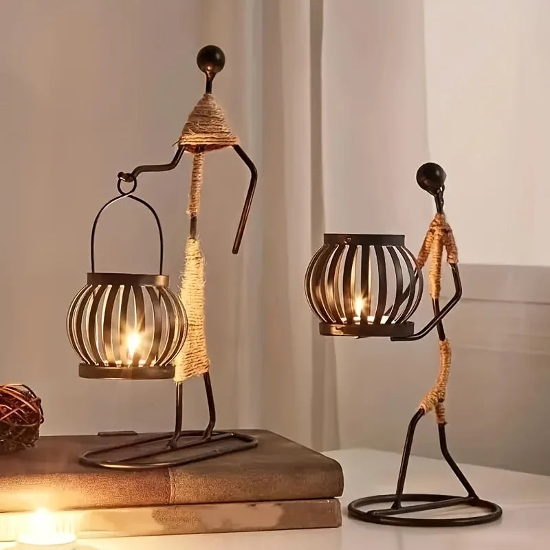 Nordic metal candle holder featuring an abstract character sculpture by 𝕄𝕔 𝕋𝕙𝕖 𝔹𝕝𝕒𝕔𝕜 𝔻𝕚𝕒𝕞𝕠