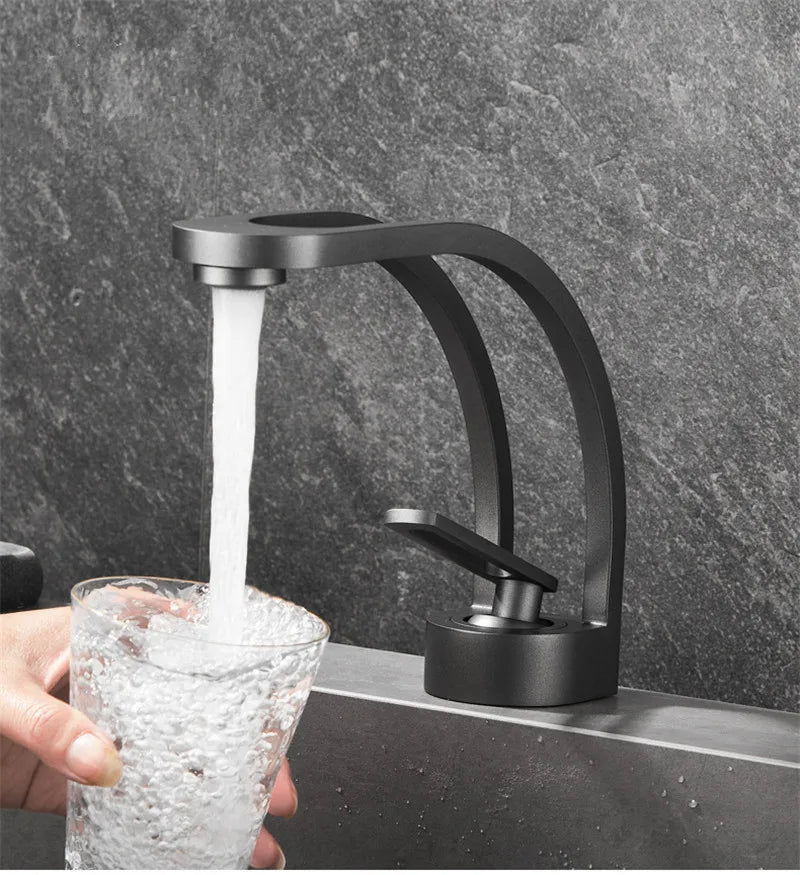 Black, grey, white, and gold bathroom mixer tap by MC THE BLACK DIAMOND for wash basin installation.