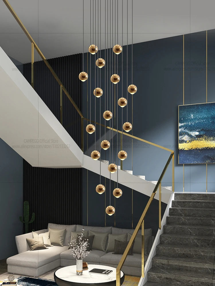 Modern MC THE BLACK DIAMOND LED staircase pendant light hanging in a living room, showcasing sleek design and warm illumination.