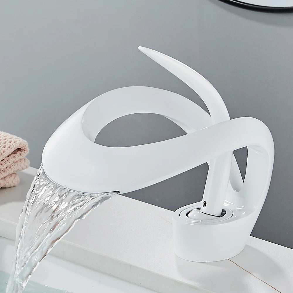 Solid brass waterfall basin faucet with single handle for hot and cold water, designed for bathroom sinks by MC THE BLACK DIAMOND.