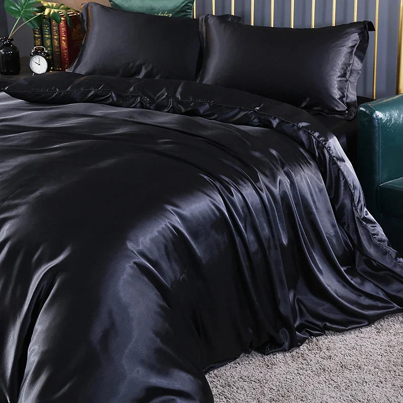 Luxury silk bedding set with duvet cover, fitted and flat sheets, and pillowcases in solid color, king and queen sizes.