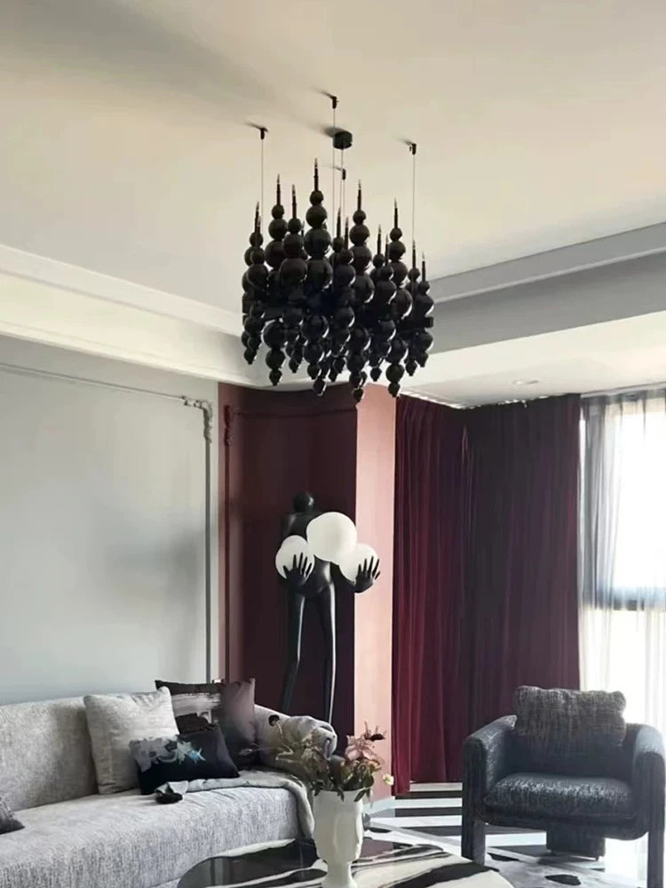 Luxury black chandelier by MC THE BLACK DIAMOND featuring moon-shaped tears, perfect for living rooms and dining areas.