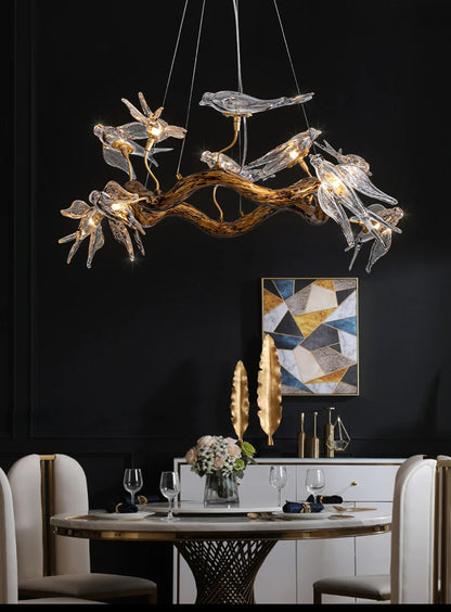 Vintage round bird chandelier with swallow design by MC THE BLACK DIAMOND, featuring intricate metalwork and hanging light fixtures.