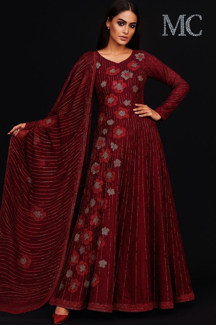 Red velvet floral suit made from Stretch Velvet fabric, featuring a luxurious red velvet material with floral patterns.