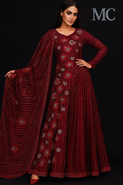 Red velvet floral suit made from Stretch Velvet fabric, featuring a luxurious red velvet material with floral patterns.