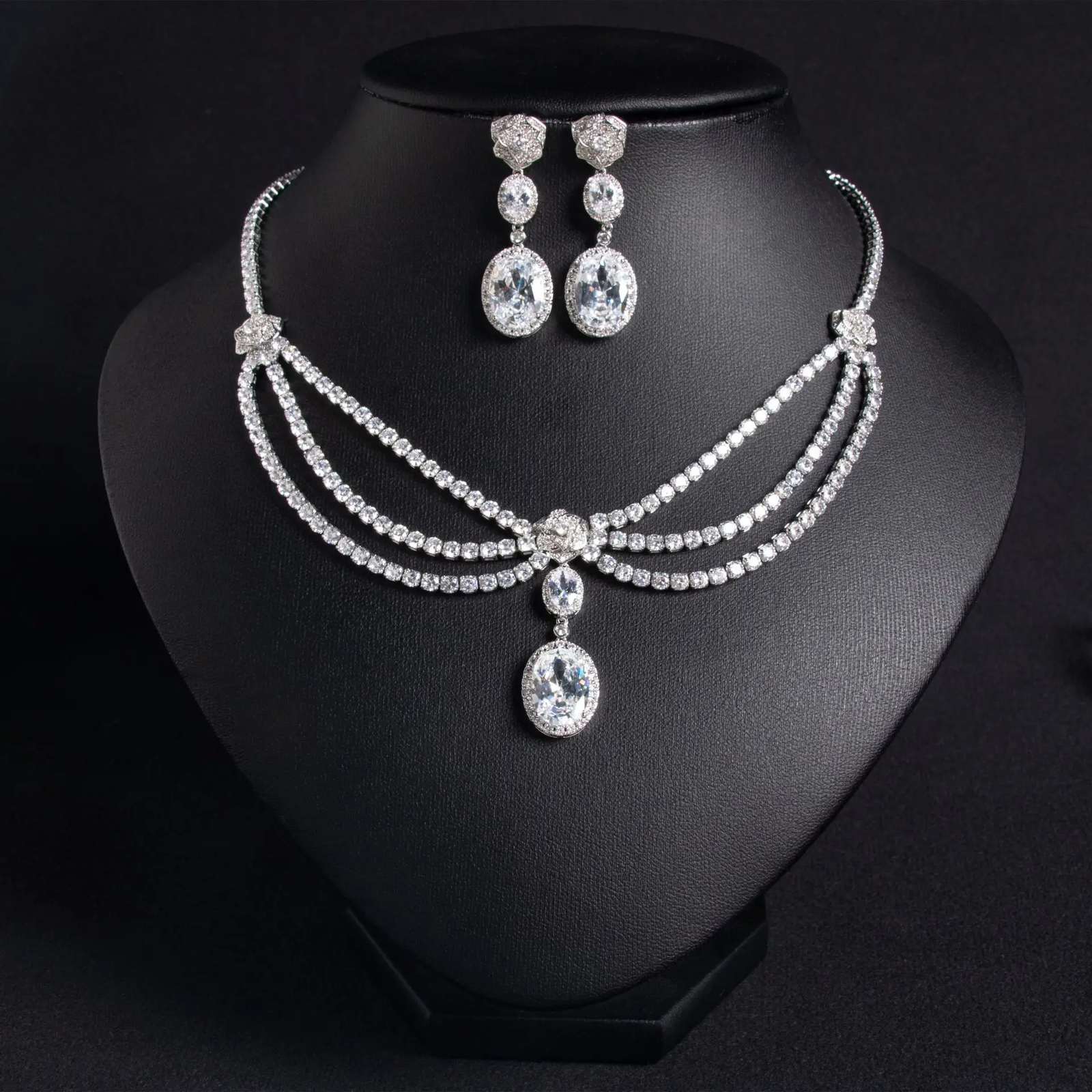 Elegant women's jewelry set with zircon flower tassel necklace and matching earrings, featuring green accents and intricate design.