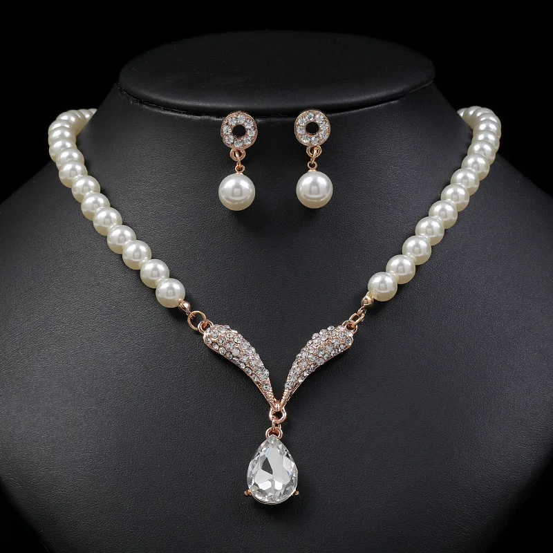 Women's pearl jewelry set by Mohammad Collection featuring a gold necklace and earrings for versatile styling.