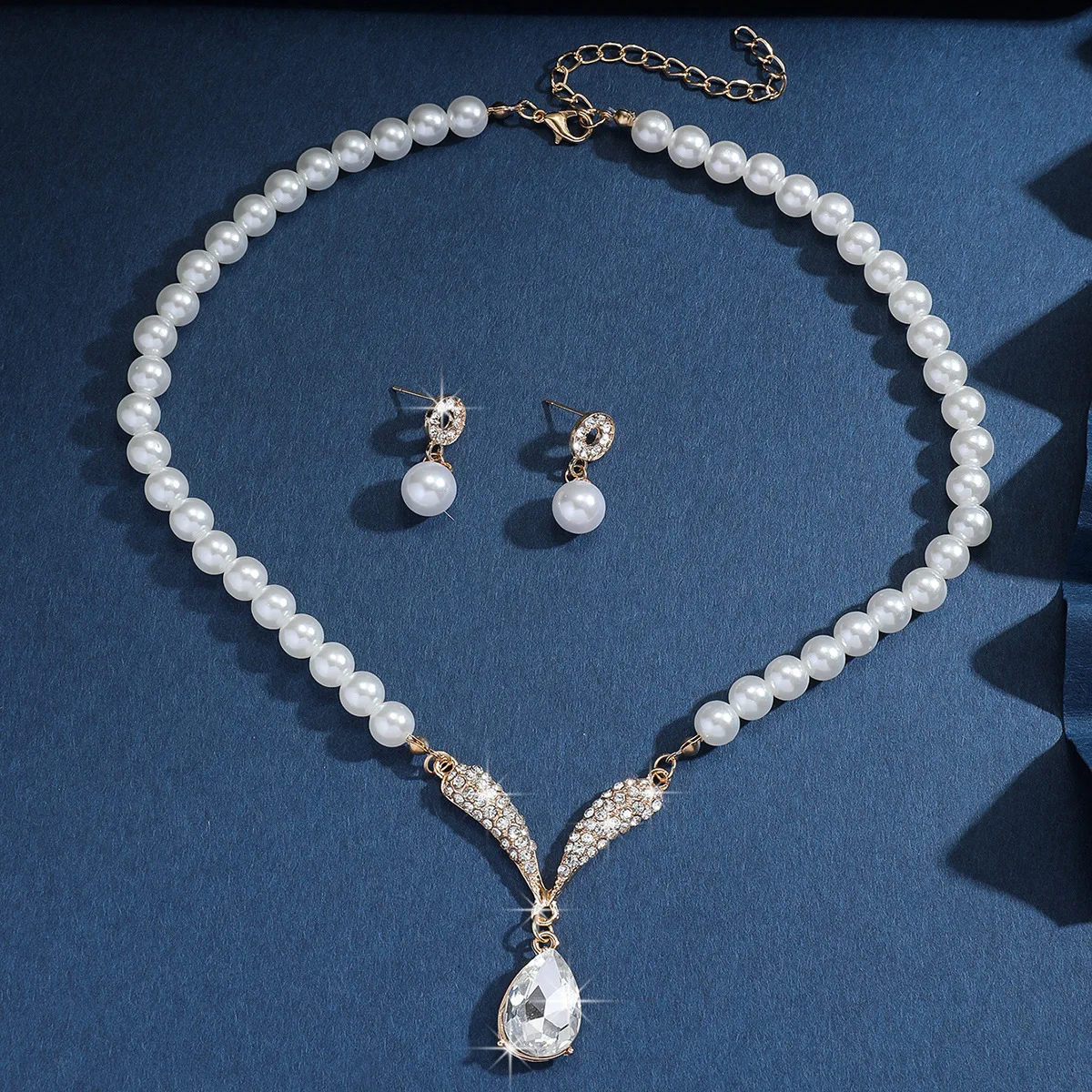 Mohammad Collection women's 3-piece pearl jewelry set with gold necklace and matching earrings, versatile for elegant styling.