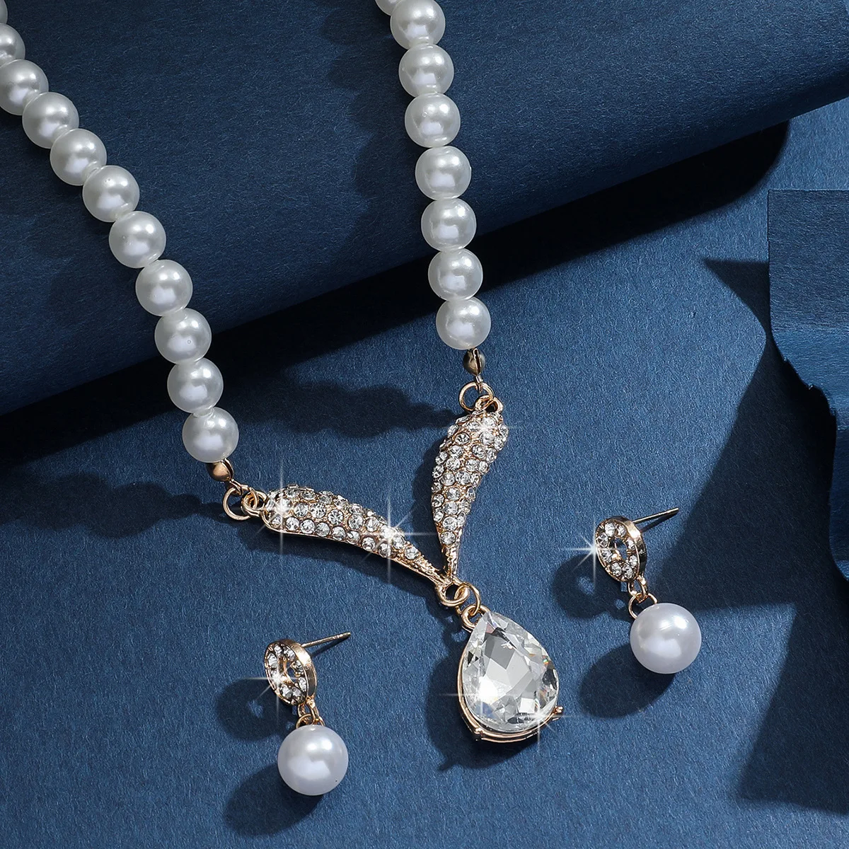 Mohammad Collection women's 3-piece pearl jewelry set with gold necklace and earrings, versatile for elegant styling.