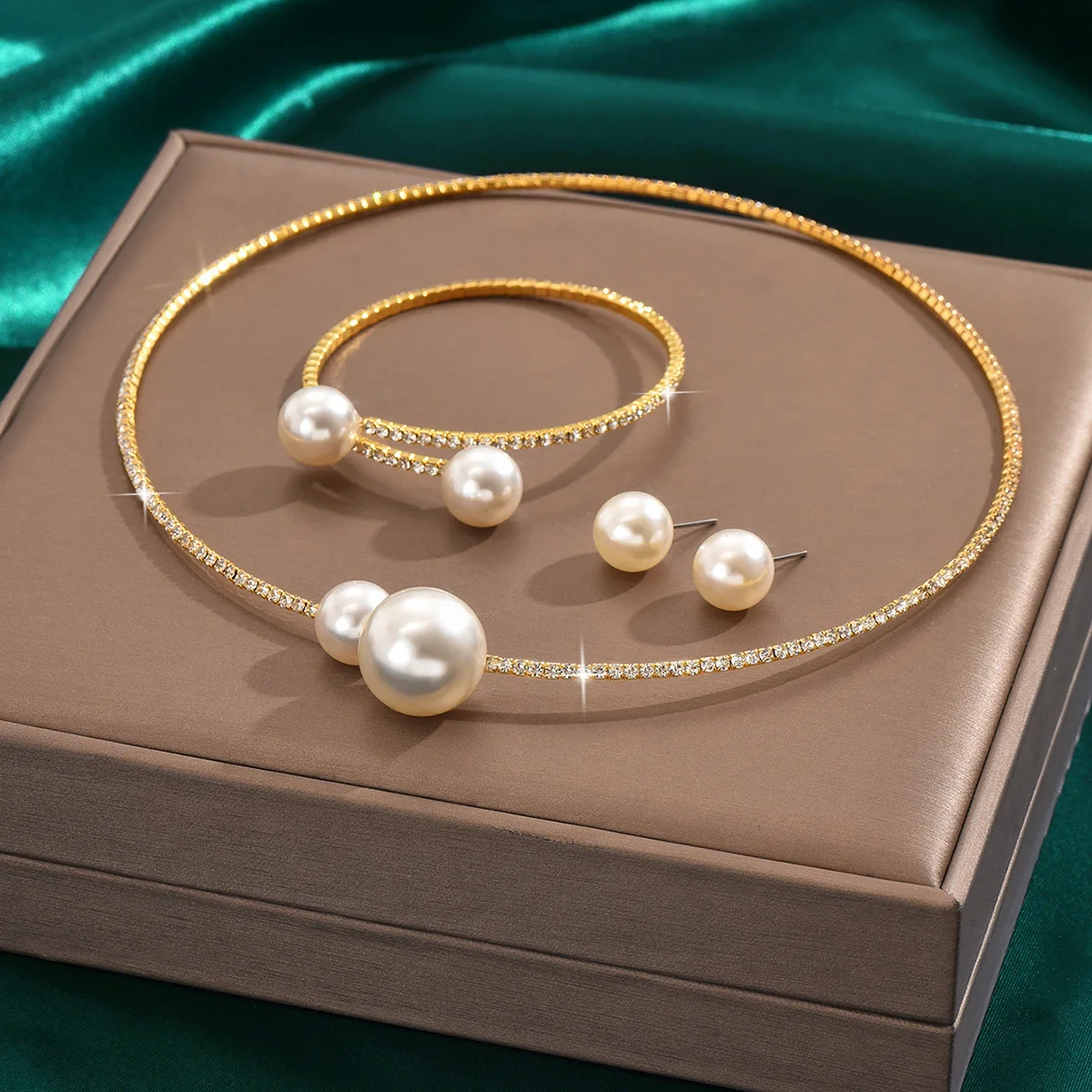 Mohammad Collection trendy full crystal jewelry set with minimalist pearl necklace, bracelet, and earrings on a white background.